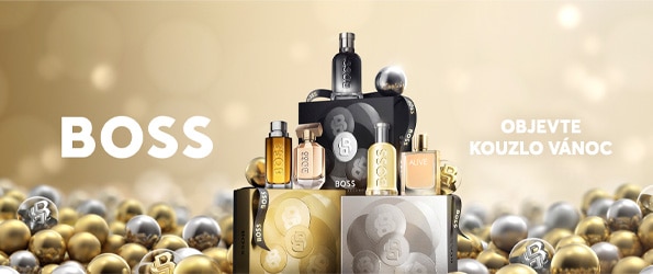 Hugo Boss vánoční dárkové sady parfémů v elegantním zlatém a stříbrném balení obklopené vánočními ozdobami.